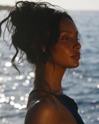 Jasmine Tookes with messy updo hairstyle