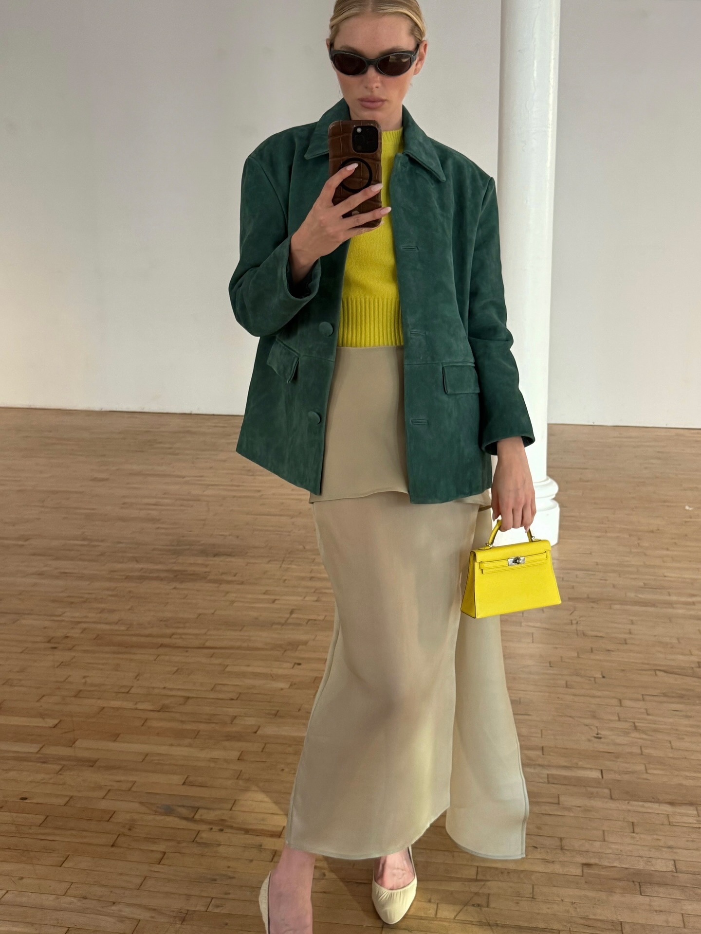 Elsa Hosk takes a mirror selfie wearings the green and yellow colour trend.