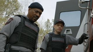 Screenshot of Russell and Travis looking down at punctured tire in The Pickup