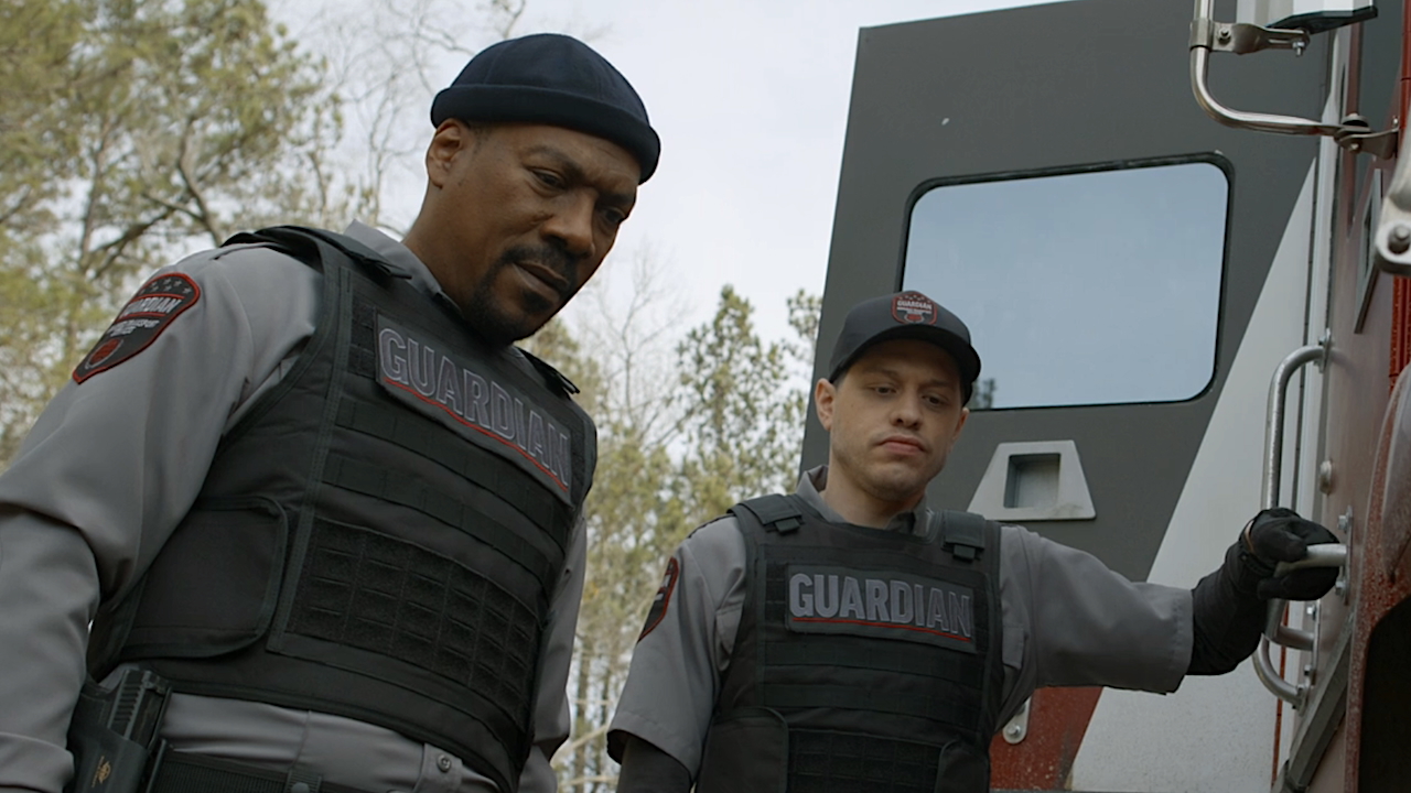 Screenshot of Russell and Travis looking down at punctured tire in The Pickup