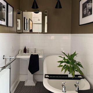 bathroom with bathtub mirror on wall with wash basin