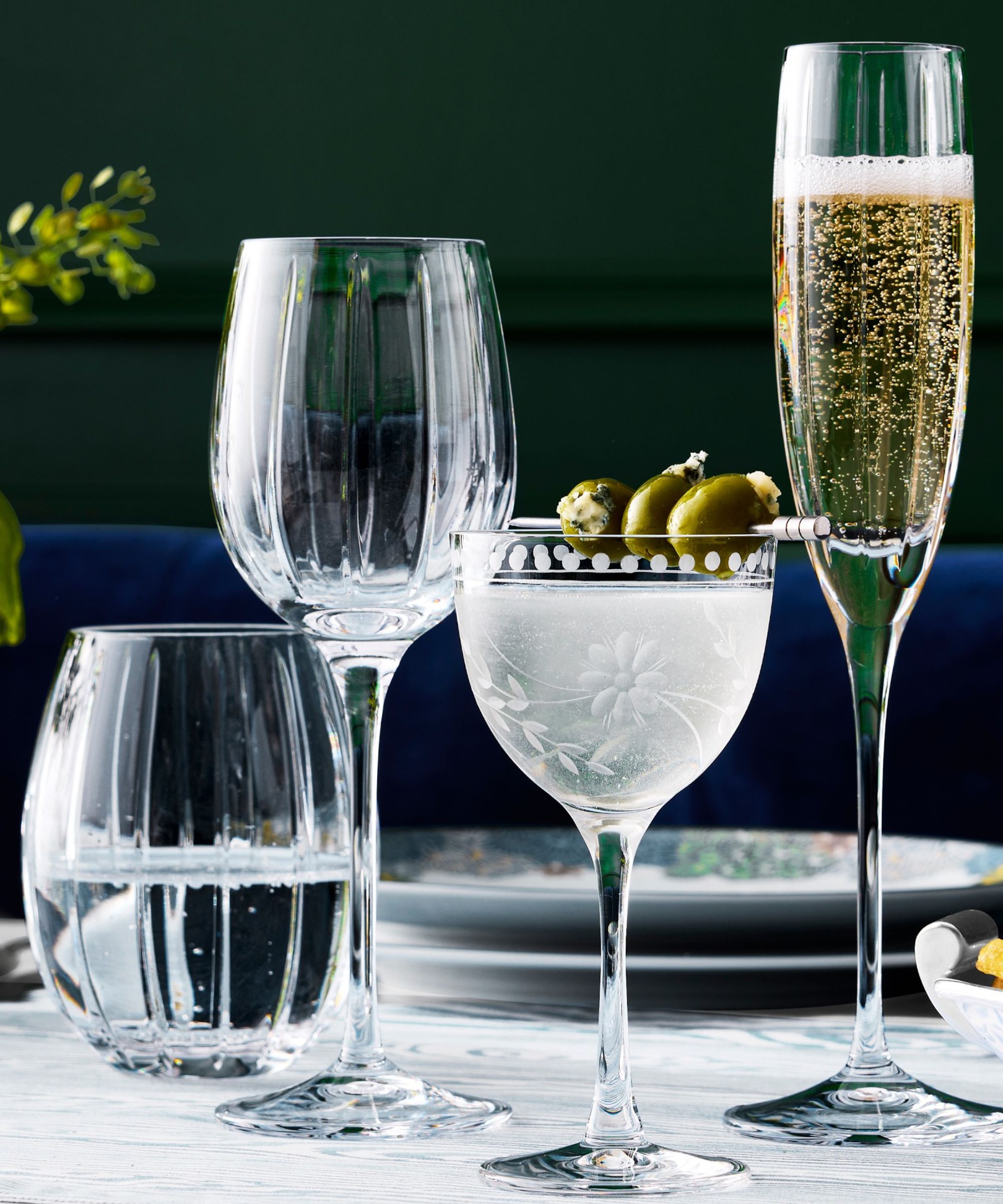 Ribbed wine glasses and etched Nick and Nora glass