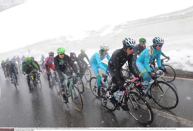 The maglia rosa, Rigoberto Uran, bundled up against the elements on the Gavia pass