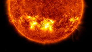 A powerful X1-class solar flare erupts from an active sunspot in the center of the sun on Oct. 28, 2021 in this image from NASA's Solar Dynamics Observatory.