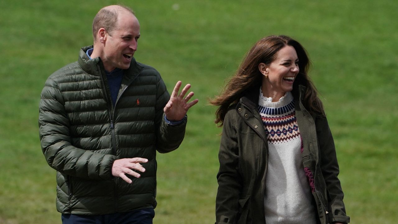 Britain&#039;s Prince William, Duke of Cambridge, and Britain&#039;s Catherine, Duchess of Cambridge, react during a visit to Manor Farm in Little Stainton, near Durham, north east England on April 27, 2021. 