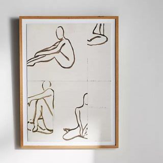 A piece of framed artwork with gold figures