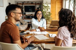 Young couple on a meeting with a professional financial expert.