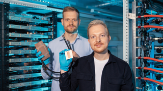 FOUNDERS - Corintis founders (Sam Harrison, Co-Founder, COO- Left, Remco van Erp, CEO - Right) holding Cold plate (left) and Microfluidic core (right)