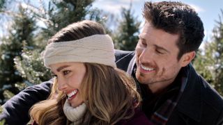 Ashley Newbrough and Marcus Rosner hug in Flipping for Christmas