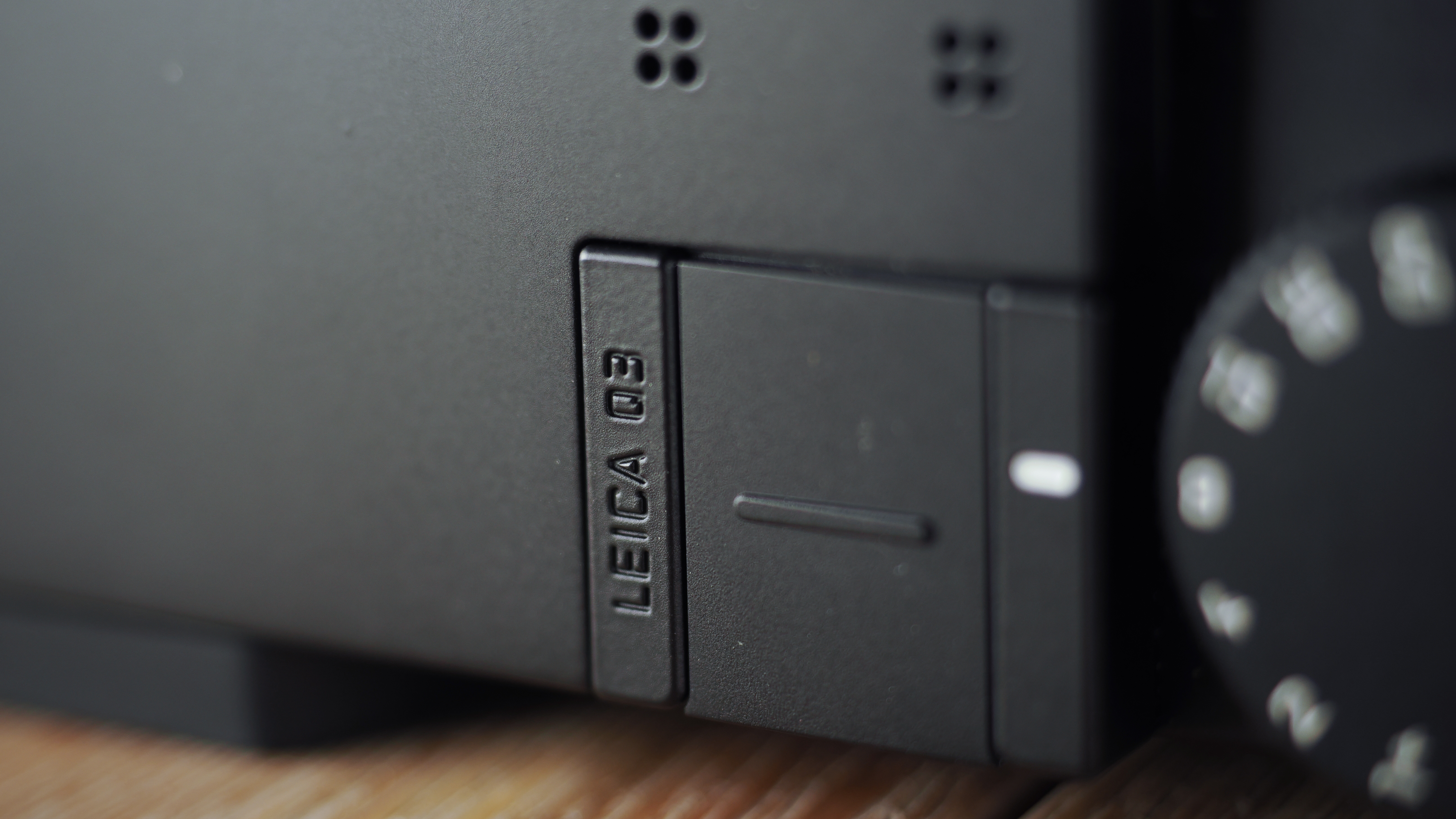 Leica Q3 Monochrom on a wooden surface