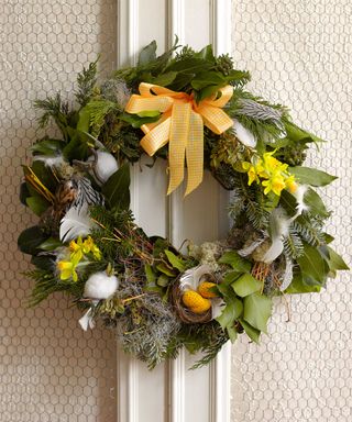 wreath with spring flowers and ribbon