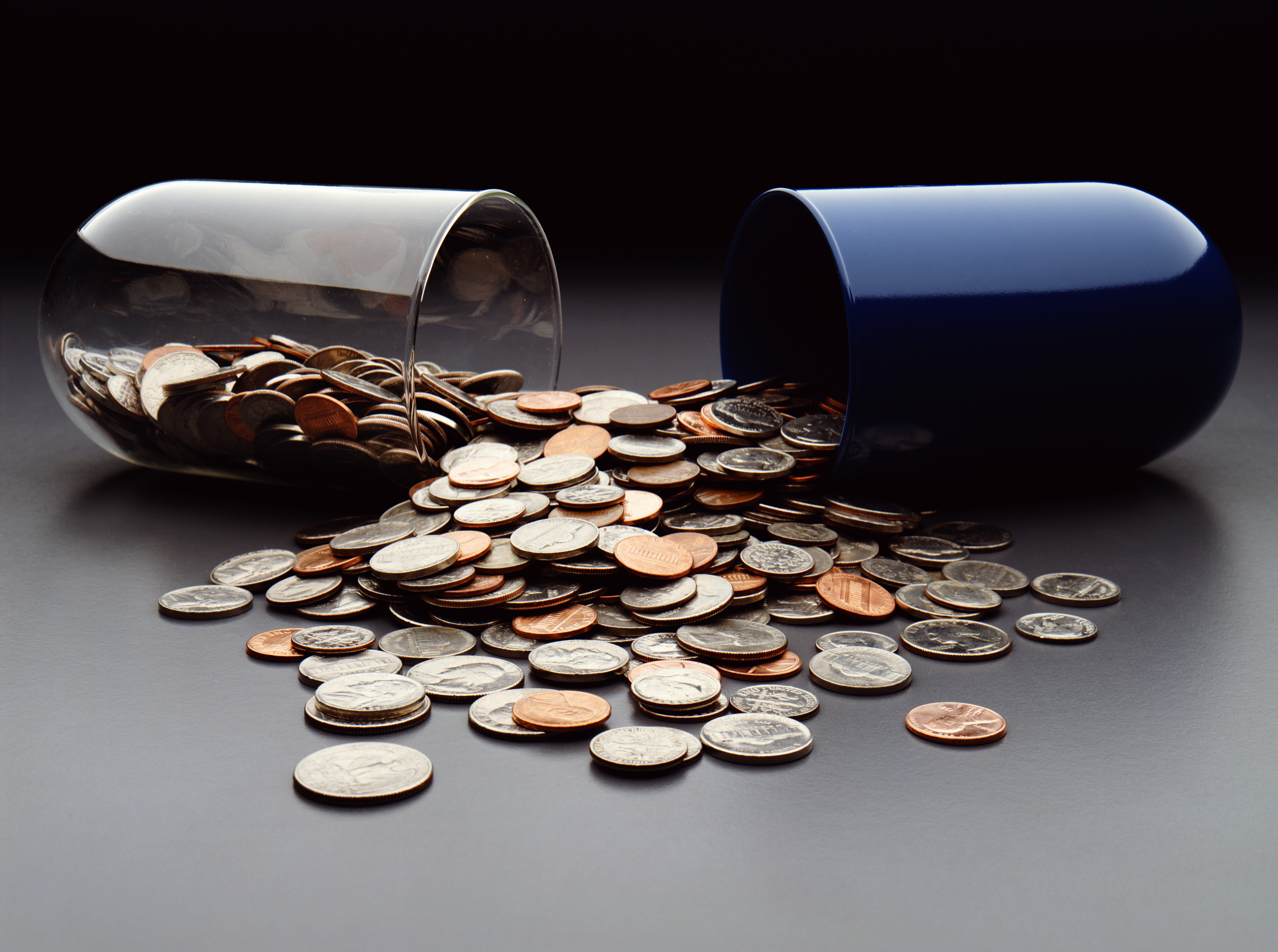 USA coins spilling out of broken capsule 