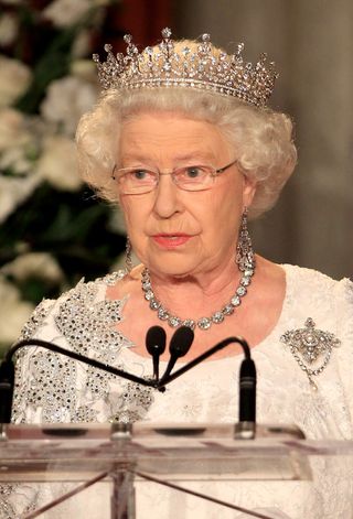 Queen Elizabeth II gives a speech during a dinner at the Royal York Hotel on July 5, 2010 in Toronto, Canada. The Queen and Duke of Edinburgh are on an eight day tour of Canada starting in Halifax and finishing in Toronto. The trip is to celebrate the centenary of the Canadian Navy and to mark Canada Day. On July 6th, the royal couple will make their way to New York where the Queen will address the UN and visit Ground Zero.
