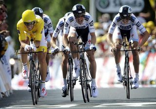 Saxo Bank is led by Fabian Cancellara across the line to keep yellow by fractions of a second.