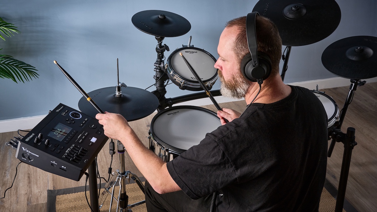 Man playing Roland TD516 electronic drum set