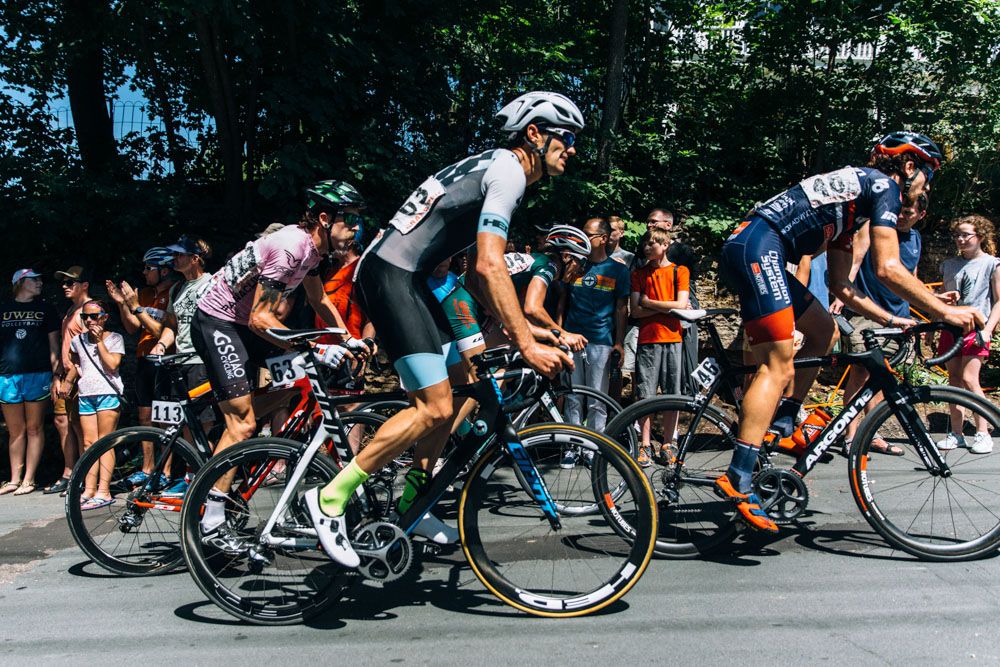 Riders from GS Ciao Cycling, Donkey Label, and Champion System ascend Chilkoot.