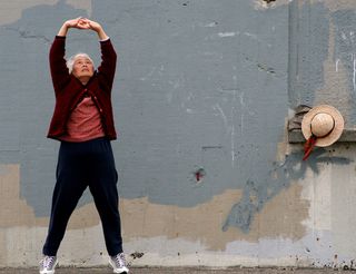 Older woman stretching, aging