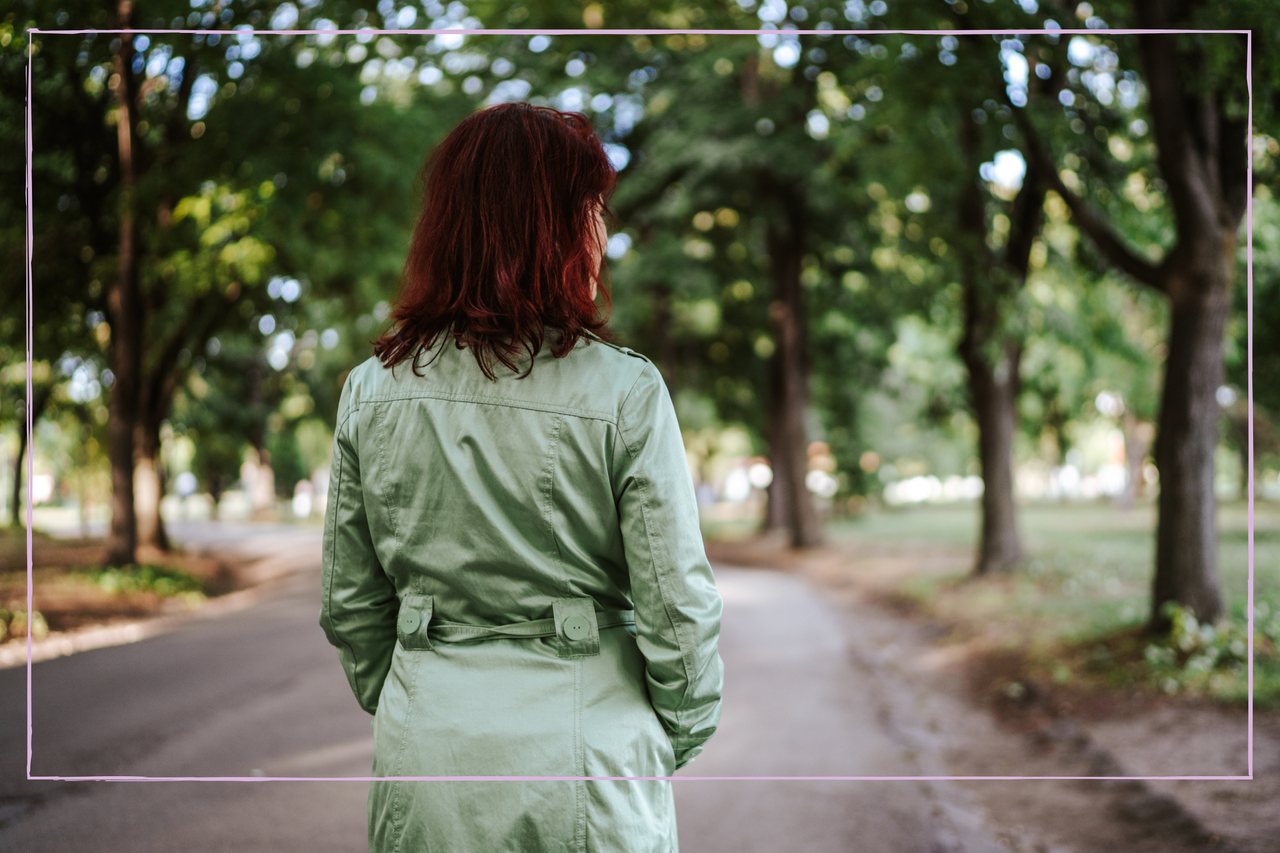 A woman in the pack with back facing the camera 