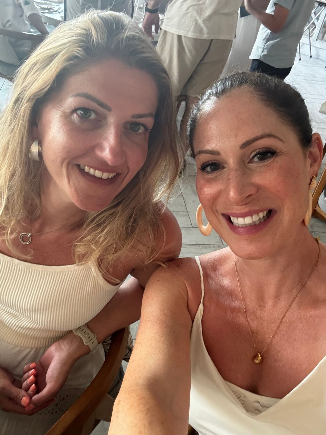 Health freelancer Anna Bartter treating friendship as a wellness habit: at a concert, at a bar, and with friends