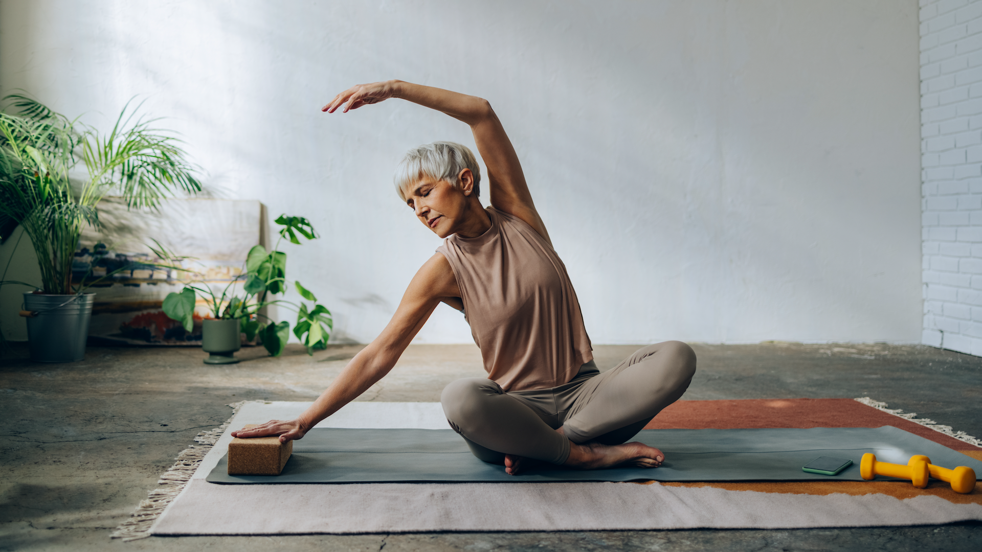 Woman stretching on a yoga mat