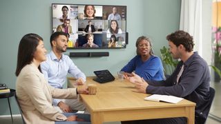 Four young professionals host a videoconference with the new Jabra and Lenovo solution.