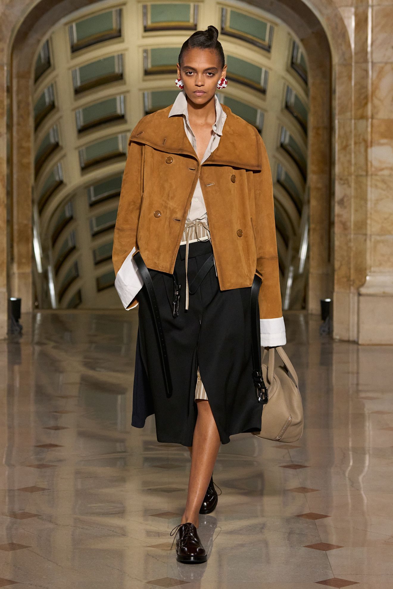 Altuzarra models wearing coats on the 2027 runway