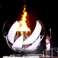 tokyo, japan july 23 naomi osaka of team japan lights the olympic cauldron with the olympic torch during the opening ceremony of the tokyo 2020 olympic games at olympic stadium on july 23, 2021 in tokyo, japan photo by patrick smithgetty images