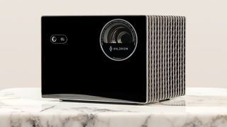 Valerion VisionMaster Max 4K projector on a marble surface