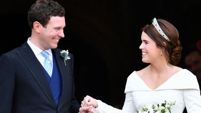 Jack Brooksbank and Princess Eugenie leave St George's Chapel after their wedding ceremony on October 12, 2018 in Windsor, England. 