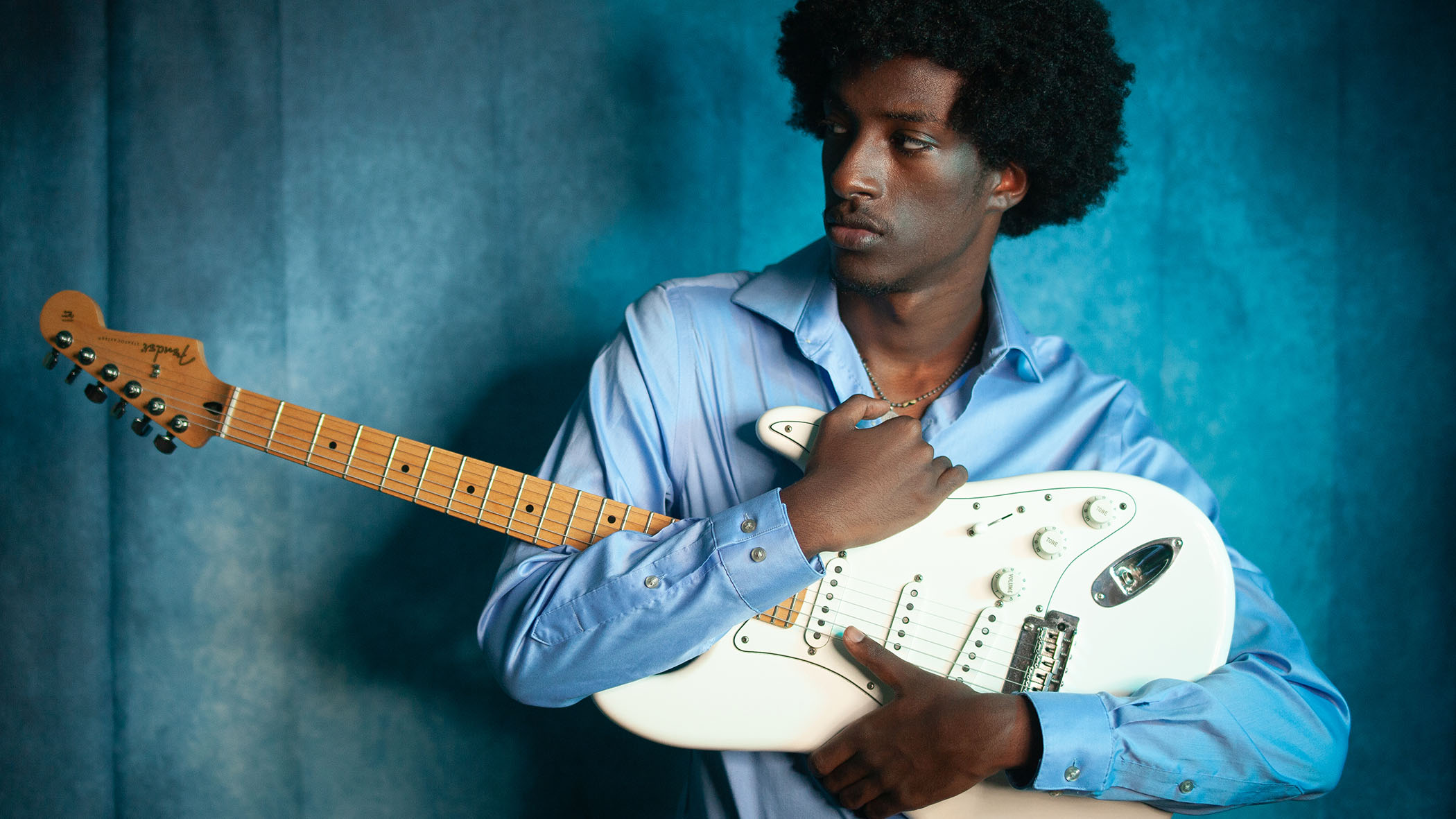 Amani Burnham with his trusty Fender Strat