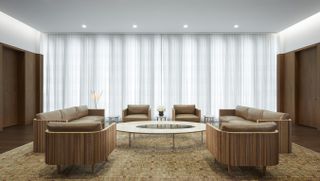 lounge space against soft translucent curtains at UAE mission by SOM