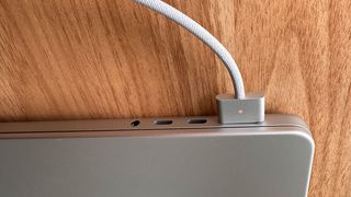 MacBook Pro being charged by MagSafe charger