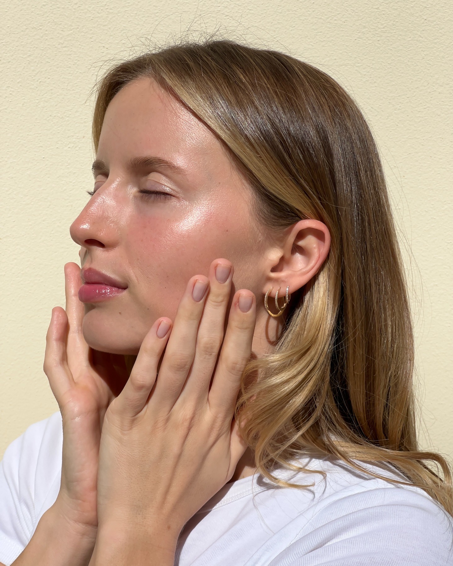 A woman with glowing skin.