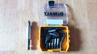 Top down shot of box of DeWalt screwdriver bits on wooden surface
