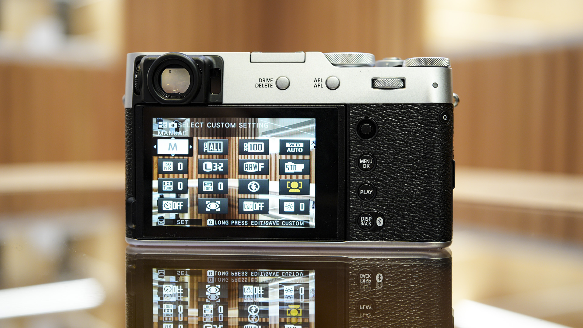 Rear of the Fujifilm X100VI with LCD screen on