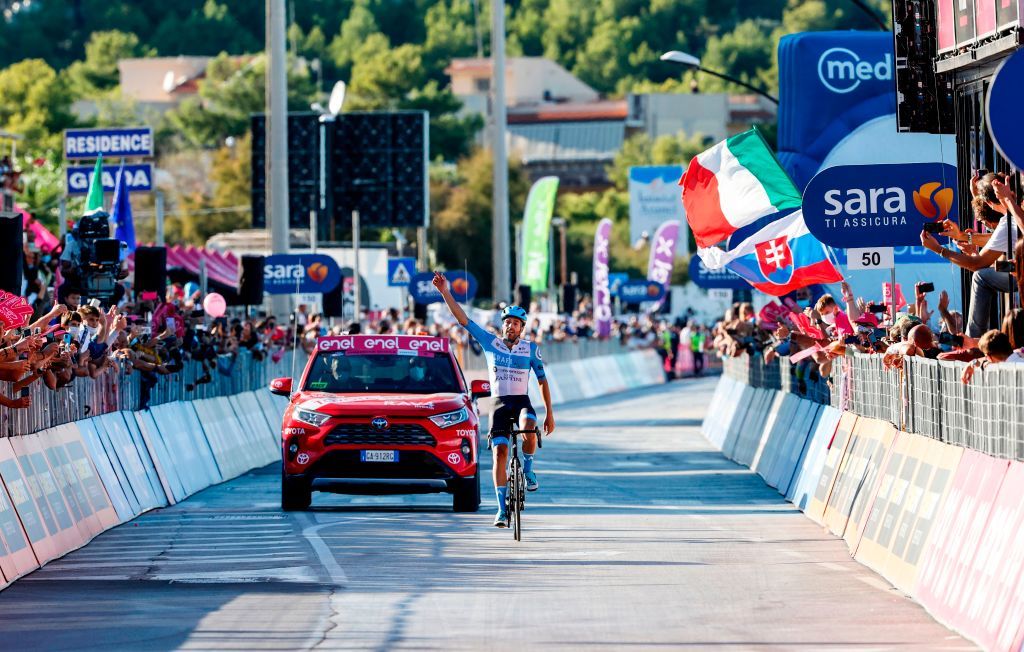 Team Israel StartUp Nation rider Englands Alex Dowsett celebrates as he crosses the line for victory during the 8th stage of the Giro dItalia 2020 cycling race a 200kilometer route between Giovinazzo and Vieste on October 10 2020 Photo by Luca Bettini AFP Photo by LUCA BETTINIAFP via Getty Images