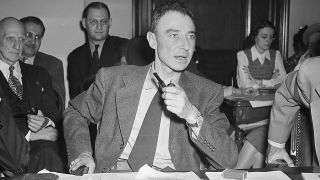 A black and white photograph of J. Robert Oppenheimer.