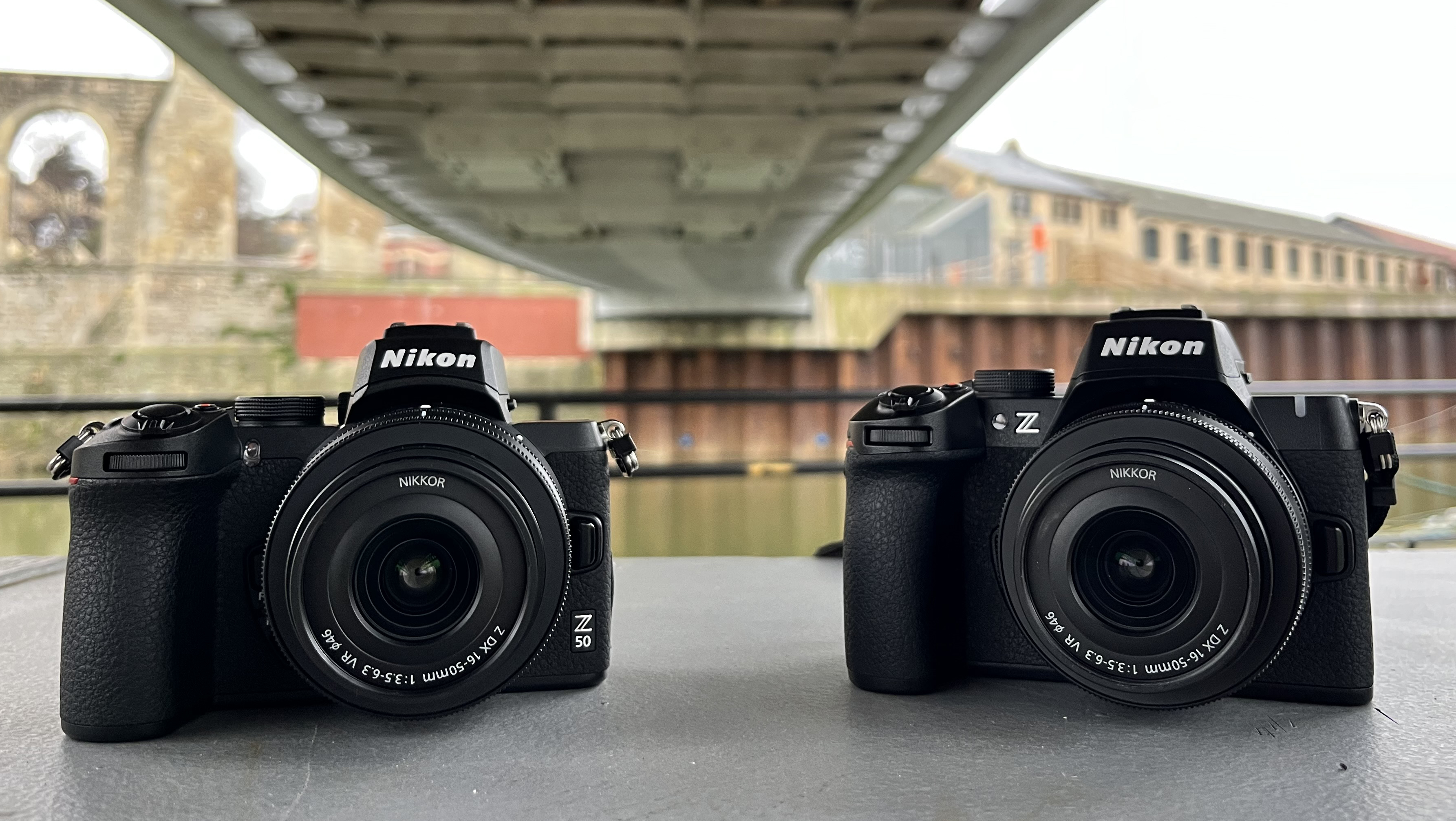 Nikon Z50 next to Nikon Z50 II under bridge
