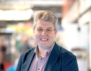 Headshot of self build expert Mark Stevenson against out of focus background