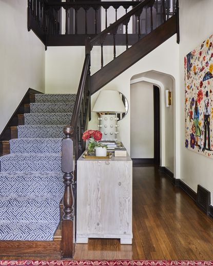 Traditional hallway with patterned blue runner