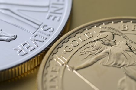 Photo of gold and silver bullion coins side by side.