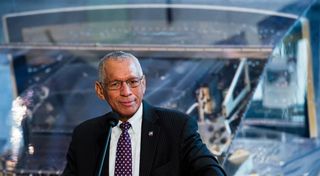 NASA Administrator Charles Bolden, who was the pilot of the space shuttle mission that launched the Hubble Space Telescope on April 24, 1990, is seen backdropped by the WFPC2 instrument at the debut of the "Repairing Hubble" exhibit at the National Air and Space Museum in Washington, D.C. on April 23, 20