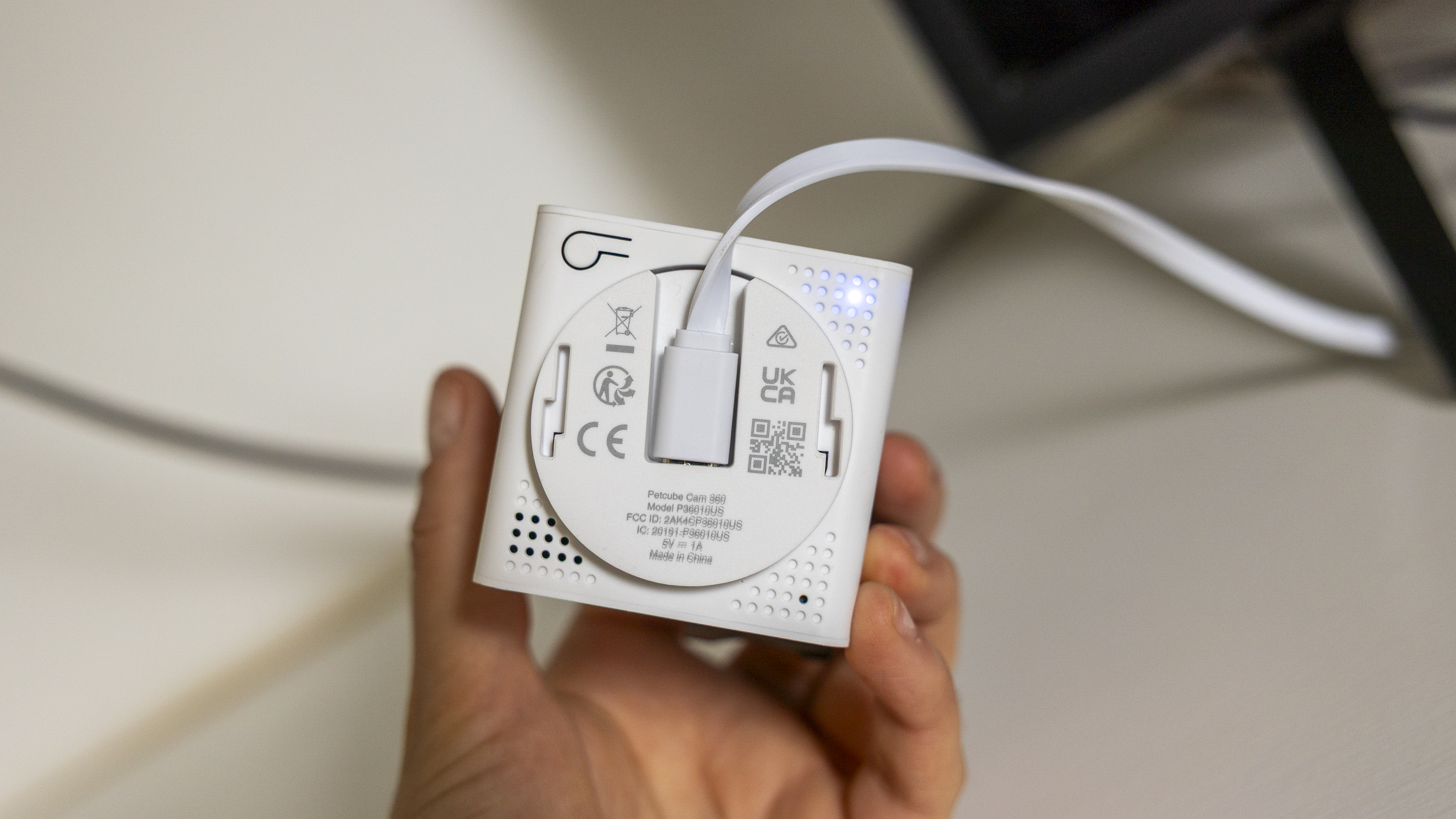 The Petcube Cam 360 in a white living room