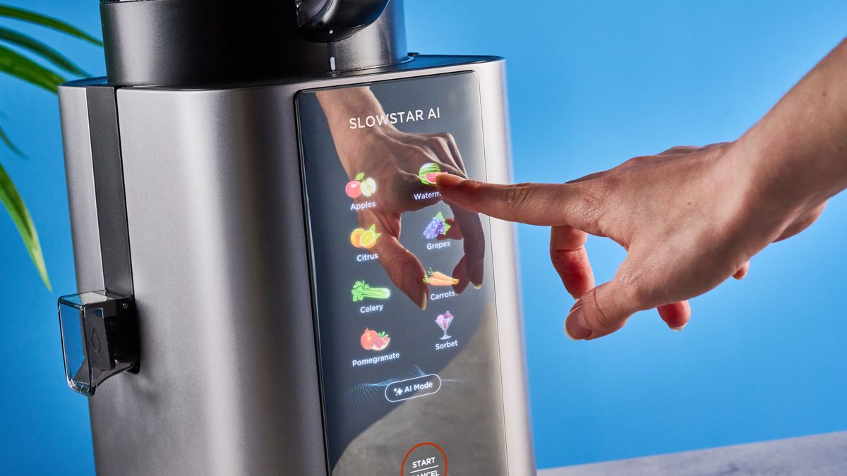 Tribest Slowstar AI Vertical Hopper Juicer photographed in front of a blue background