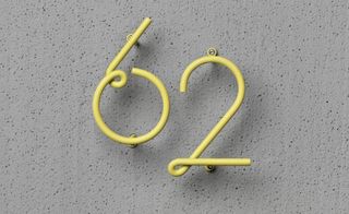 A set of powder-coated metal wire house number