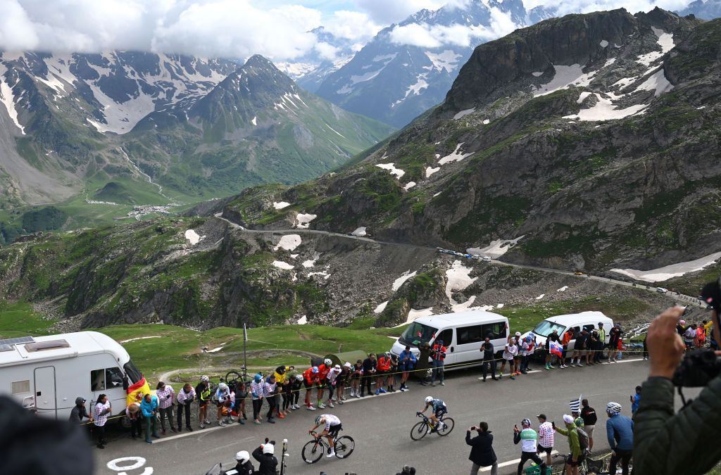 VALLOIRE FRANCE JULY 02 LR Tadej Pogacar of Slovenia and UAE Team Emirates and Jonas Vingegaard Hansen of Denmark and Team Visma Lease a Bike attack climbing to the Col du Galibier 2642m while fans cheer during the 111th Tour de France 2024 Stage 4 a 1394km stage from Pinerolo to Valloire UCIWT on July 02 2024 in Valloire France Photo by Dario BelingheriGetty Images