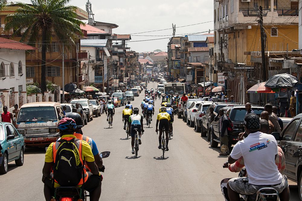 The peloton during the neutralised section on their way out of Freetown heading towards Waterloo where the race started proper.