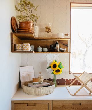 Italian kitchen decor with a tile backsplash and open shelves displaying kitchenware