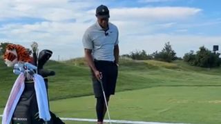 Tiger Woods on the driving range at Liberty National