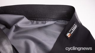 Assos Mille GT Thermo Rain Shell Pants detail of waste and Neos Ultra fabric